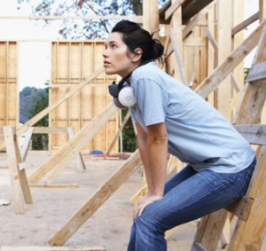 Woman Resting on Construction Site