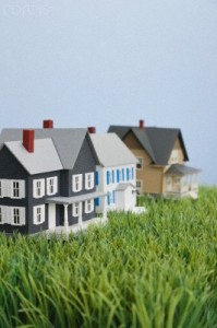 Close up of model houses on fake grass