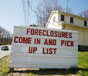 A Realtor advertises houses for sale due to foreclosure in Stroudsburg, Pa.