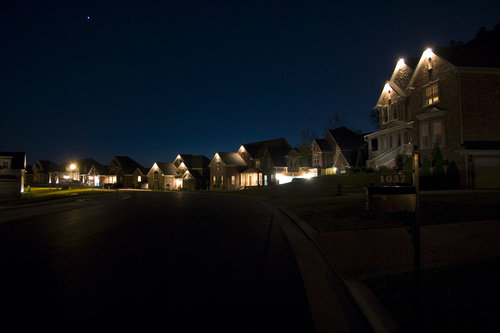 homes-houses-at-night-suburb-town-community-real-estate