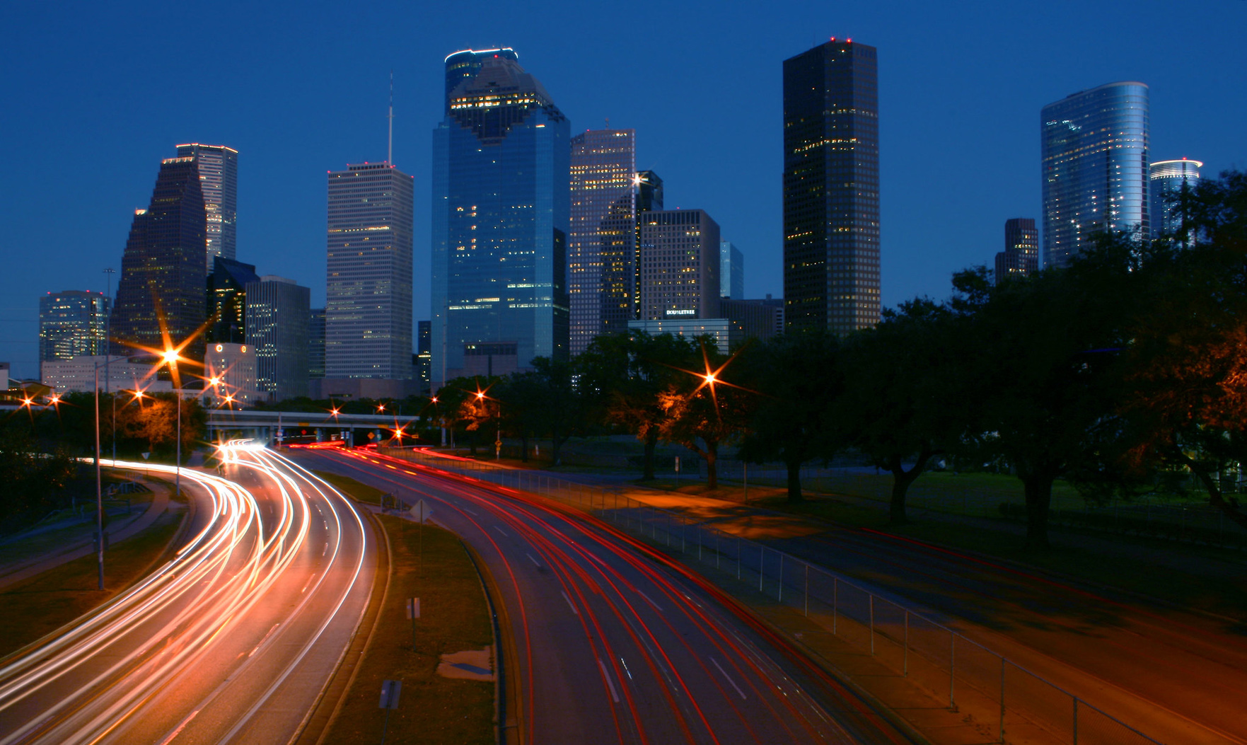 Houston skyline real estate summer activity slowing
